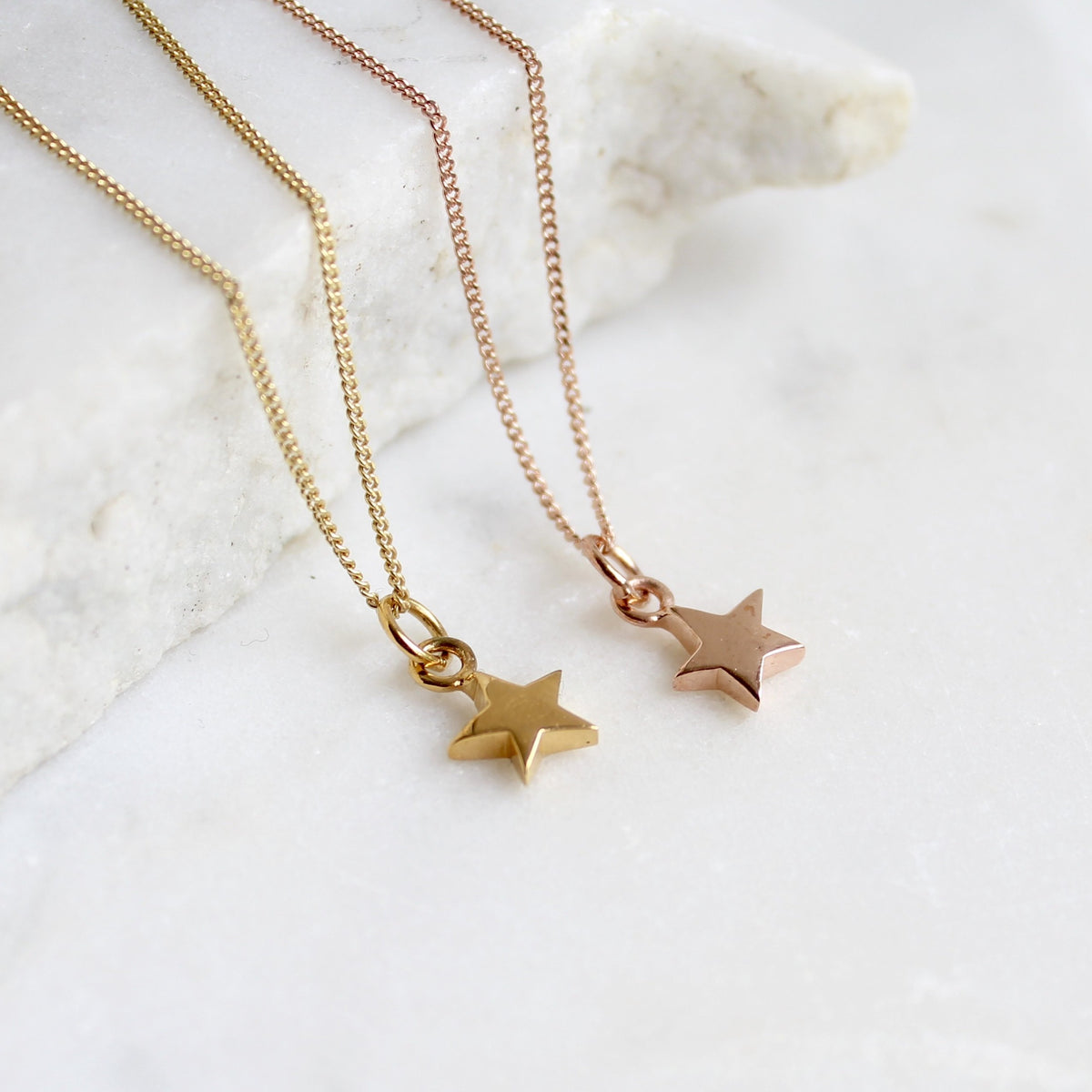 Simple gold star on sale necklace